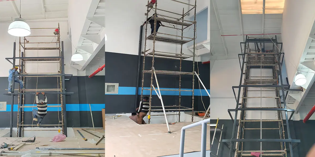 بئر مصعد فولاذي بواجهة زجاجية داخل بهو